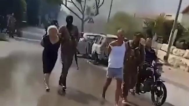 A still taken from video verified by The New York Times appears to show several Israelis being taken hostage by Hamas militants in the Be’eri kibbutz, southeast from the border with Gaza in southern Israel. Picture: Twitter