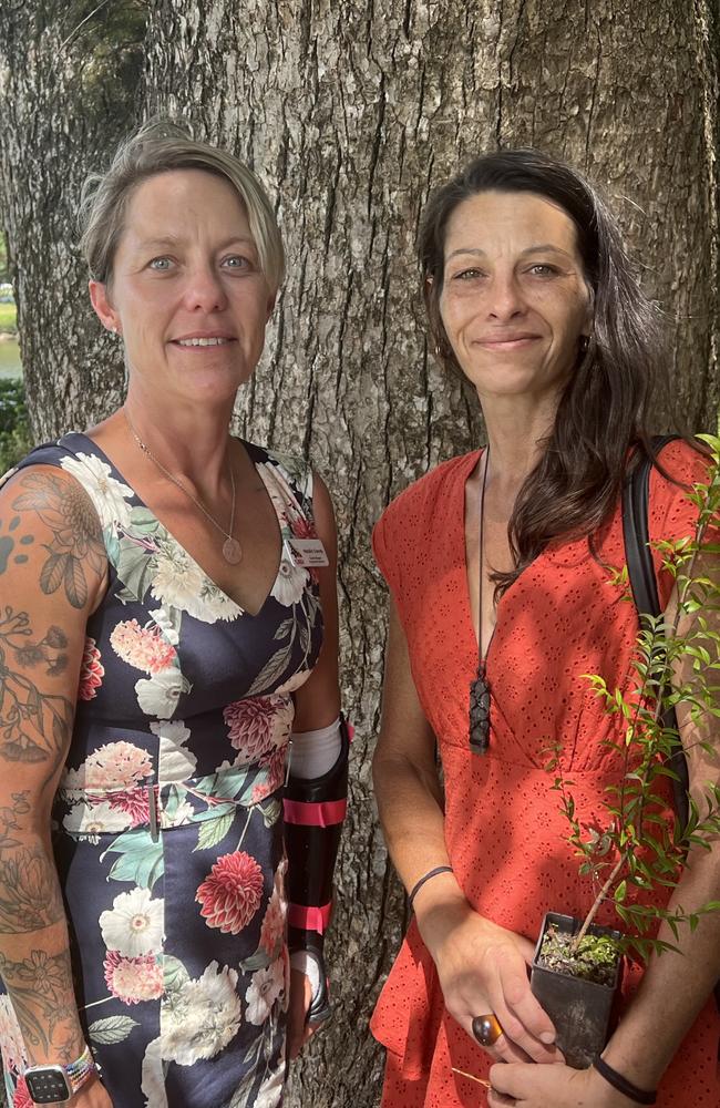 Tweed residents Natalie Grandy (left) and Jasmine dos Remedios at a flood remembrance service at Murwillumbah. Picture: David Bonaddio