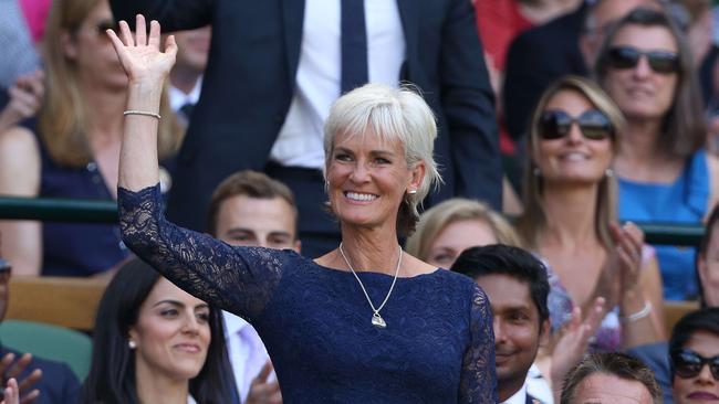 British tennis coach and mother of Britain's Andy Murray, Judy Murray, stands and waves in the royal box on centre court before the start of the men's singles third round match between Australia's Samuel Groth and Switzerland's Roger Federer.