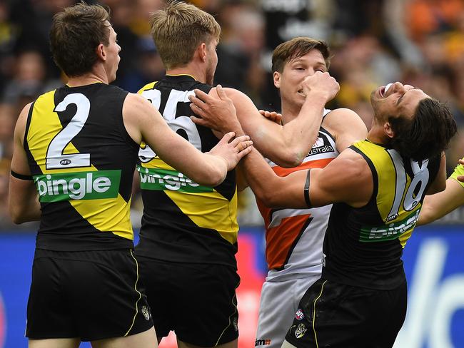 Toby Greene of the Giants tangles with Alex Rance of the Tigers.