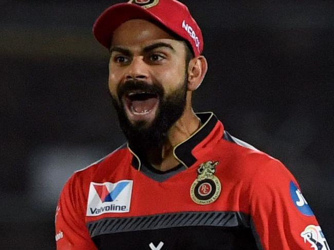 Royal Challengers Bangalore captain Virat Kohli reacts after Rajasthan Royals captain Ajinkya Rahane was dismissed by Rajasthan Royals bowler Yuzvendra Chahal during the 2019 Indian Premier League (IPL) Twenty20 cricket match between Rajasthan Royals and Royal Challengers Bangalore at the Sawai Mansingh Stadium in Jaipur on April 2, 2019. (Photo by Money SHARMA / AFP) / IMAGE RESTRICTED TO EDITORIAL USE - STRICTLY NO COMMERCIAL USE