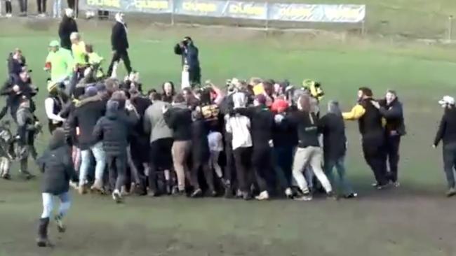 Lobethal fans storm the ground to celebrate with players after the club's dramatic premiership win in extra time. Picture: Filming Footy