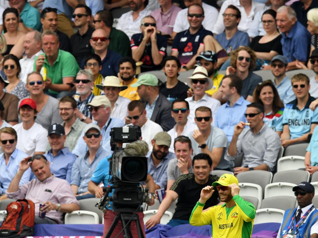 David Warner fields within earshot of the abuse. (Photo by Saeed KHAN / AFP)