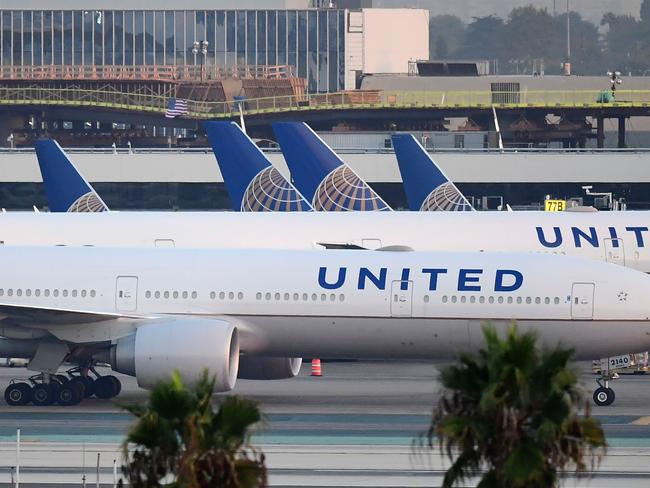 (FILES) In this file photo taken on October 01, 2020 United Airlines aircraft are seen on the tarmac at Los Angeles International Airport in Los Angeles, California in October 1, 2020. - Airline shares tumbled October 6, 2020 after President Donald Trump ended talks with congressional leaders on another fiscal stimulus package until after the November elections. (Photo by Frederic J. BROWN / AFP)