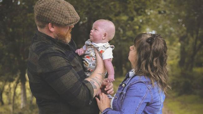 Jennifer and Matthew with their son Teddy who was born via IVF after a generous donation from a stranger. Picture: Caters News