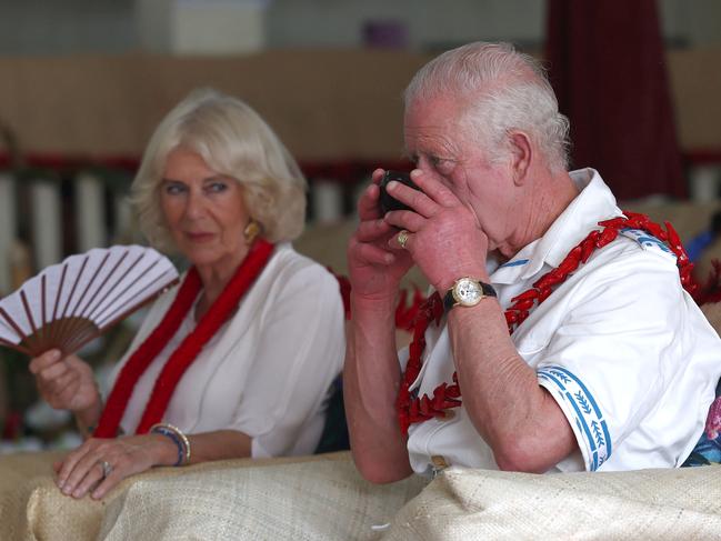 King Charles drinks kava, locally known as "ava", as Queen Camilla looks on. Picture: AFP