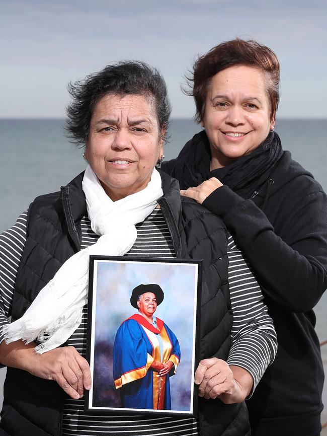 Dr ALitya Rigney’s daughters Eileen Wanganeen and Tracy Rigney, with a photo of their mother, who passed away last year. Picture: Dylan Coker