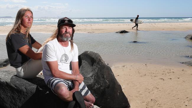 Fellow surfers Alicia Bain and Jason Gibbs were some of the first to reach Nick Slater after he was attacked by a Great White Shark at Greenmount. Picture: Glenn Hampson