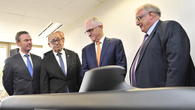 Then prime minister Malcolm Turnbull, with French and Australian defence officials, inspects a model of the French submarine in Adelaide in 2016. Picture: AAP