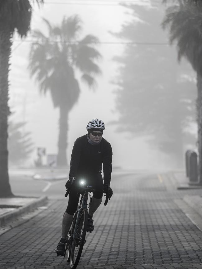 A cyclist at Grange Beach, Sunday, August 16. Picture: MIKE BURTON