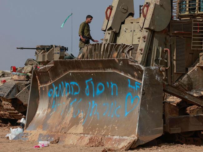 Israeli troops and military vehicles are positioned near the border with the Gaza Strip. Picture: AFP