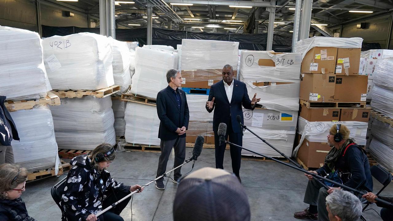 Pallets of aid to Ukraine are stacked behind Secretary of Defense Lloyd Austin (R) and Secretary of State Antony Blinken (L) as they speak with reporters after returning from their trip to Kyiv in Poland near the Ukraine border. Picture: Alex Brandon / AFP