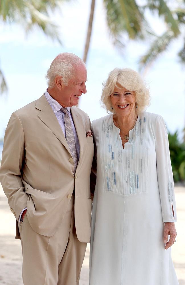 King Charles III and Queen Camilla pose for a photograph during a visit to a beach in Apia, Samoa. Picture: AFP / Getty Images