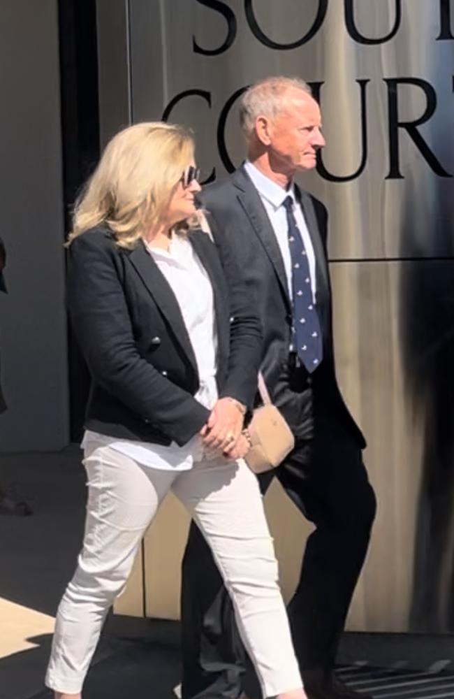 Dr Anthony Philip Benjamin (right) leaving the Southport courthouse with his wife. Picture: Jessica Paul