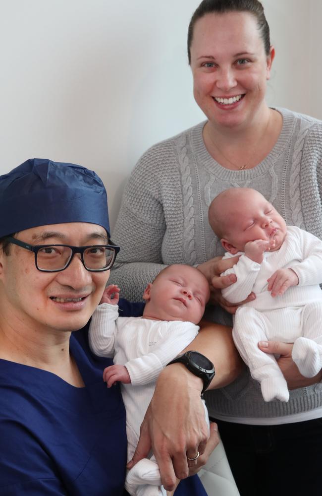 Senior Monash IVF specialist Dr Kee Ong with (at the time) six-weekold twins Oakley and Camden Hutchinson from Pacific Pines and mother Jennie Wood. Picture: Glenn Hampson