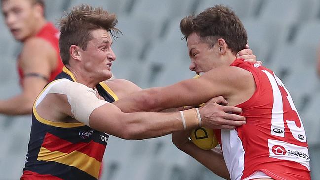 AFL - Adelaide Crows v Sydney Swans at the Adelaide Oval. Matt Crouch tries to stop Oliver Florent  Picture SARAH REED