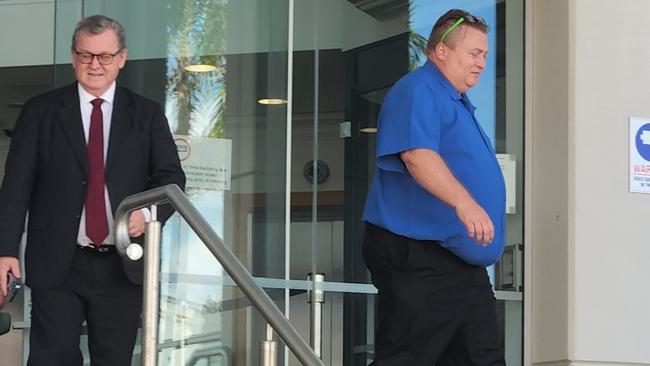 Craig Paul Carrington (right) at Rockhampton Courthouse with David Mills, part of his legal team.