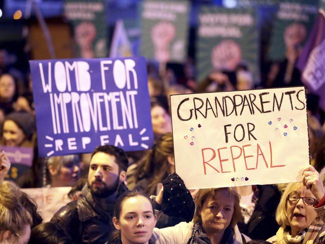 People carry various signs as they take part in a march calling for the repeal of the 8th amendment to the Irish constitution, in Dublin. Picture: Niall Carson/PA via AP