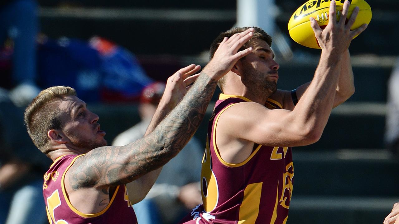 Ben Sokol climbs above a pack to mark in the WAFL.