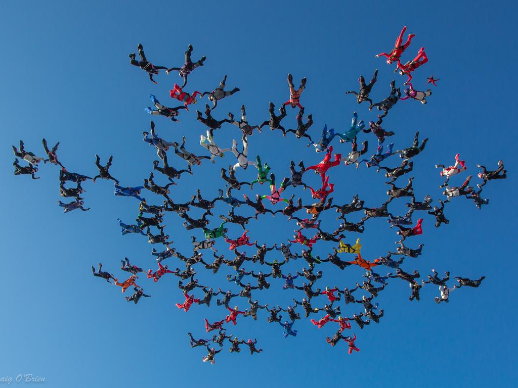 A supplied undated image obtained Monday, June 3, 2019 shows a formation of 130 people linked up in freefall over Perris, Southern California. The 130 person formation is a new Australian record in large formation skydiving. (AAP Image/Supplied by Craig O'Brien) NO ARCHIVING, EDITORIAL USE ONLY, MANDATORY CREDIT