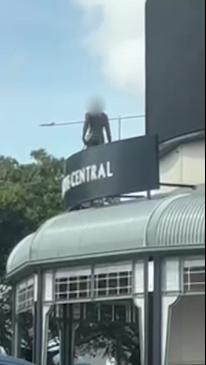 Man on roof at Cairns Central Shopping centre