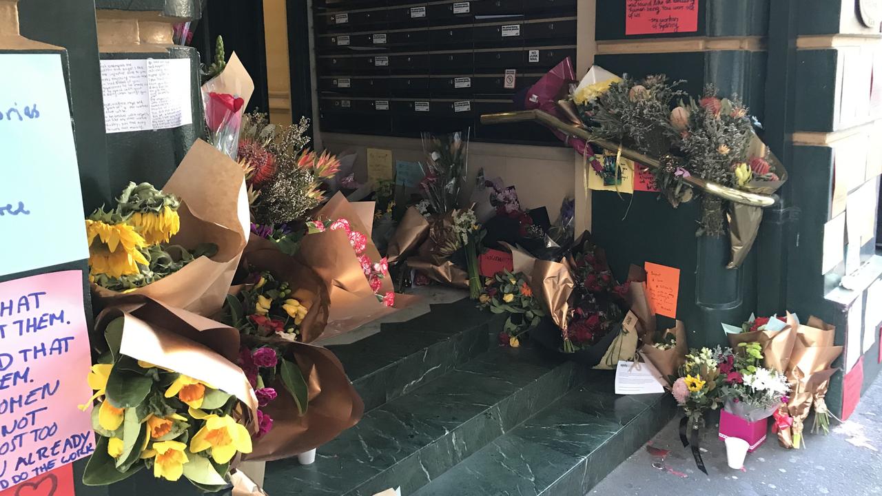 Flowers and handwritten notes left at the scene of Michaela Dunn’s murder on Clarence Street, Sydney. .