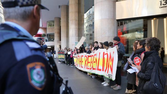 Police watch over the protesters in Sydney on Tuesday. Picture: John Grainger