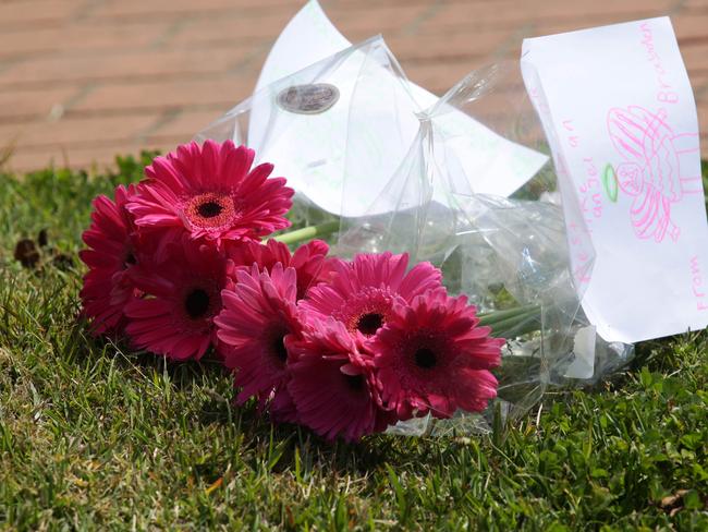 Floral tributes at the home where the 12-year-old died. Picture Waide Maguire.