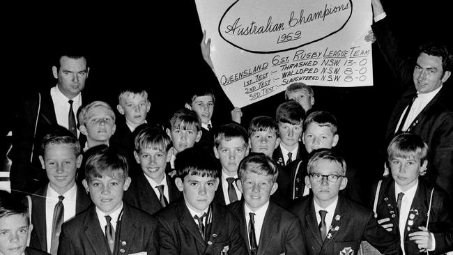 Coach Lew Cooper (far right) and his Queensland six-stone schoolboys rugby league team return home from their undefeated 1969 tour of NSW. Wayne Banks in glasses (front row, second from right) Photo: Barry Pascoe