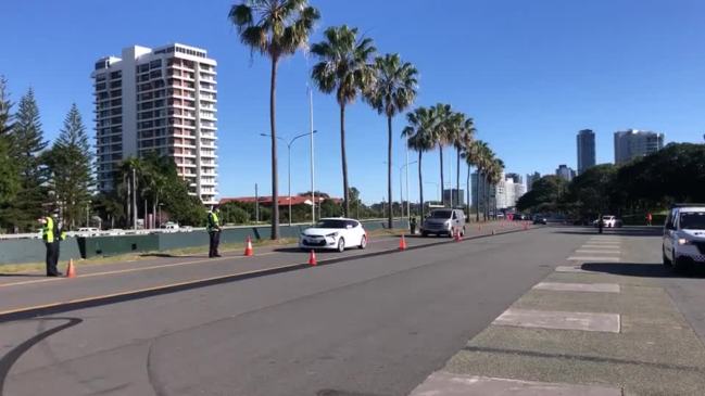 Police stop cars in Surfers Paradise during Queensland's Covid lockdown