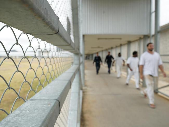 Staff escort prisoners through Queensland; Lotus Glen Correctional Centre. The male prison with a capacity to detain roughly 730 prisoners, over half of whom are Aboriginal and Torres Strait Islander prisoners. Picture: Daniel Soekov for Human Rights Watch