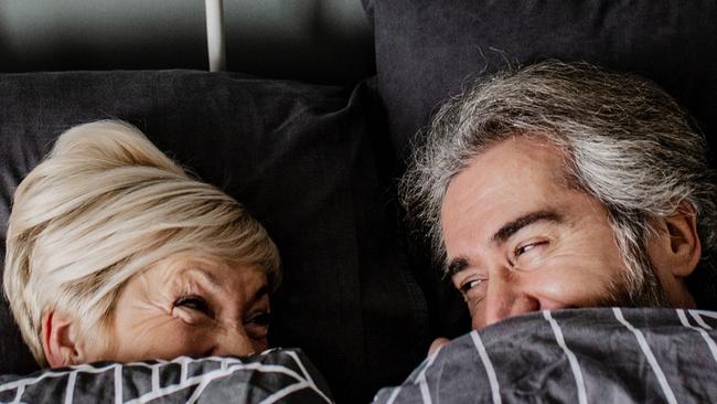 Portrait of senior couple in bed