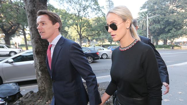 Banker Oliver Curtis arrives with his wife Roxy Jacenko at the Supreme Court. Curtis is facing insider trading charges. Picture: AAP