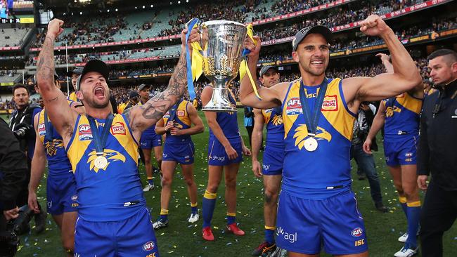 Chris Masten and Dom Sheed celebrate with the premiership cup. Picture: Phil Hillyard