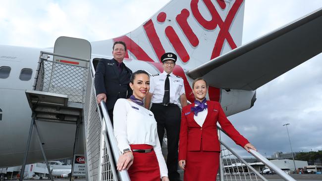 Virgin Australia crew including from L to R Nico Porter(CS), Bianca Yates, Captain Paul Anderson and Delia Taylor are set to benefit from a suite of assistance measures being rolled out by the federal government to help airlines and the tourism industry continue to recover. Picture: John Feder