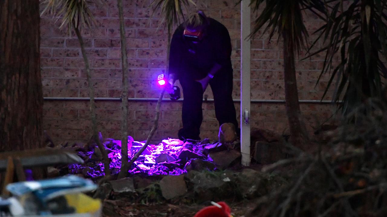 Forensic services use luminol and a blue light to look for blood traces at the front garden of the former home of William Tyrrell’s foster grandmother. Picture: Mick Tsikas/AAP