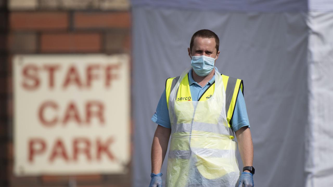 A healthcare worker looks on at a temporary coronavirus testing centre in Wales. Picture: Matthew Horwood/Getty Images