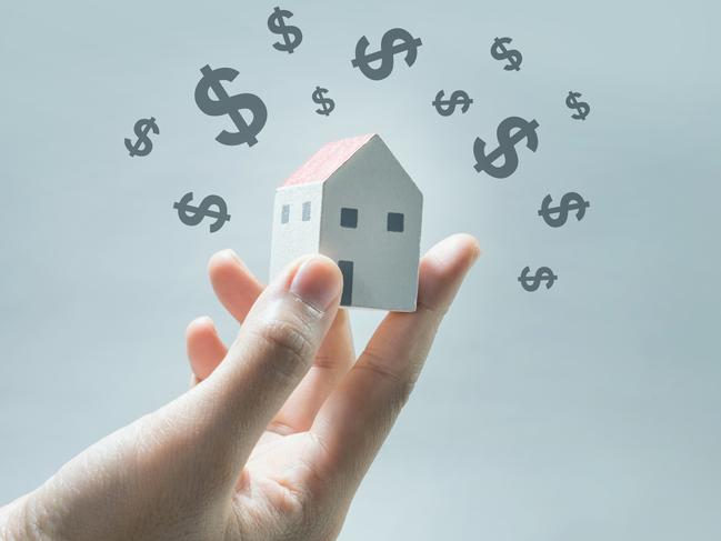 House model on human hands with dollar icon.Savings money and real estate concept. Property investing generic.