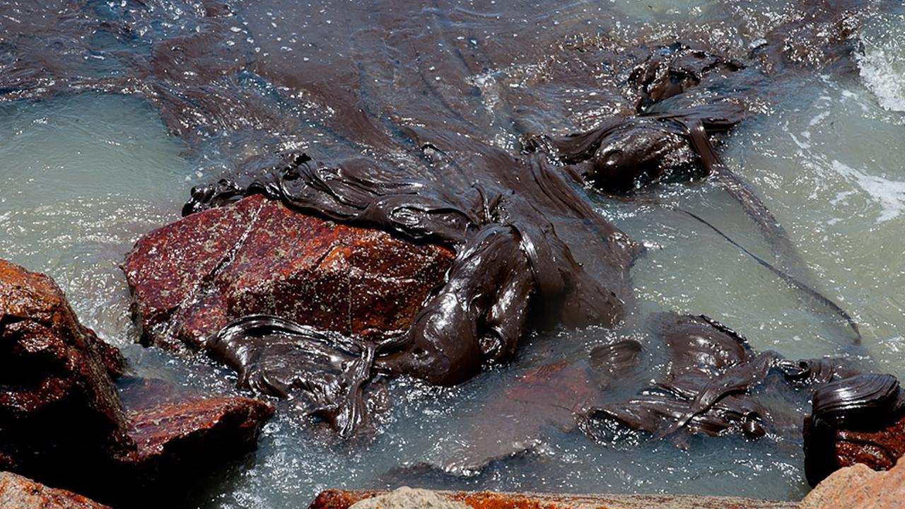 The oil sludge has now reached 61 districts in nine Brazilian states. Picture: Sergipe State Government via AP.