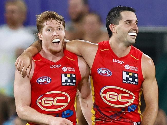 DARWIN, AUSTRALIA - MAY 16: Matt Rowell (left) and Brayden Fiorini of the Suns celebrate during the 2024 AFL Round 10 match between The Gold Coast SUNS and The Geelong Cats at TIO Stadium on May 16, 2024 in Darwin, Australia. (Photo by Michael Willson/AFL Photos via Getty Images)