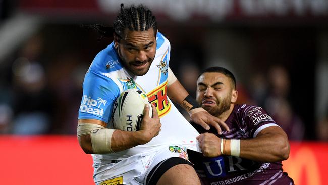 Konrad Hurrell of the Titans is tackled by Dylan Walker of the Sea Eagles during the Round 23 NRL match between the Manly-Warringah Sea Eagles and the Gold Coast Titans at Lottoland in Sydney, Friday, August 17, 2018. (AAP Image/Dan Himbrechts) NO ARCHIVING, EDITORIAL USE ONLY