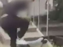 Shocking footage of the moment a teenage boy was approached by a gang and horrifically bashed outside a library in Melbourne’s western suburbs has surfaced. The 15-year-old was walking along the street in Caroline Springs when he was attacked by the group, one of which had a crowbar. Frame Grab from Seven news