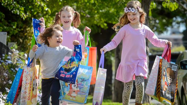 Andre, Florence and Jasmine will enjoy some of this year’s haul of show bags at home. Picture: Jay Town