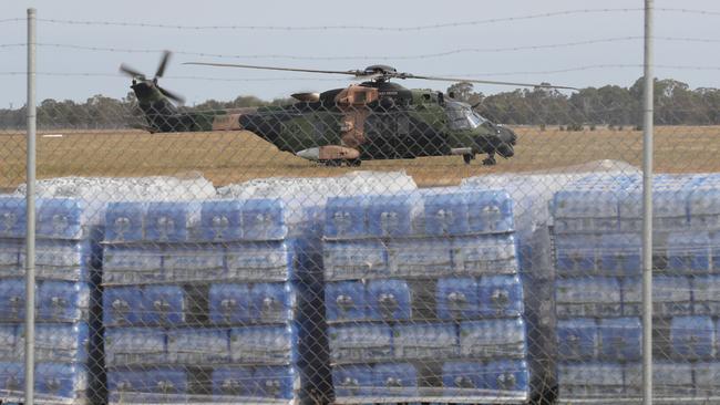 A Navy helicopter lands at Bairnsdale to refuel. Picture: David Crosling