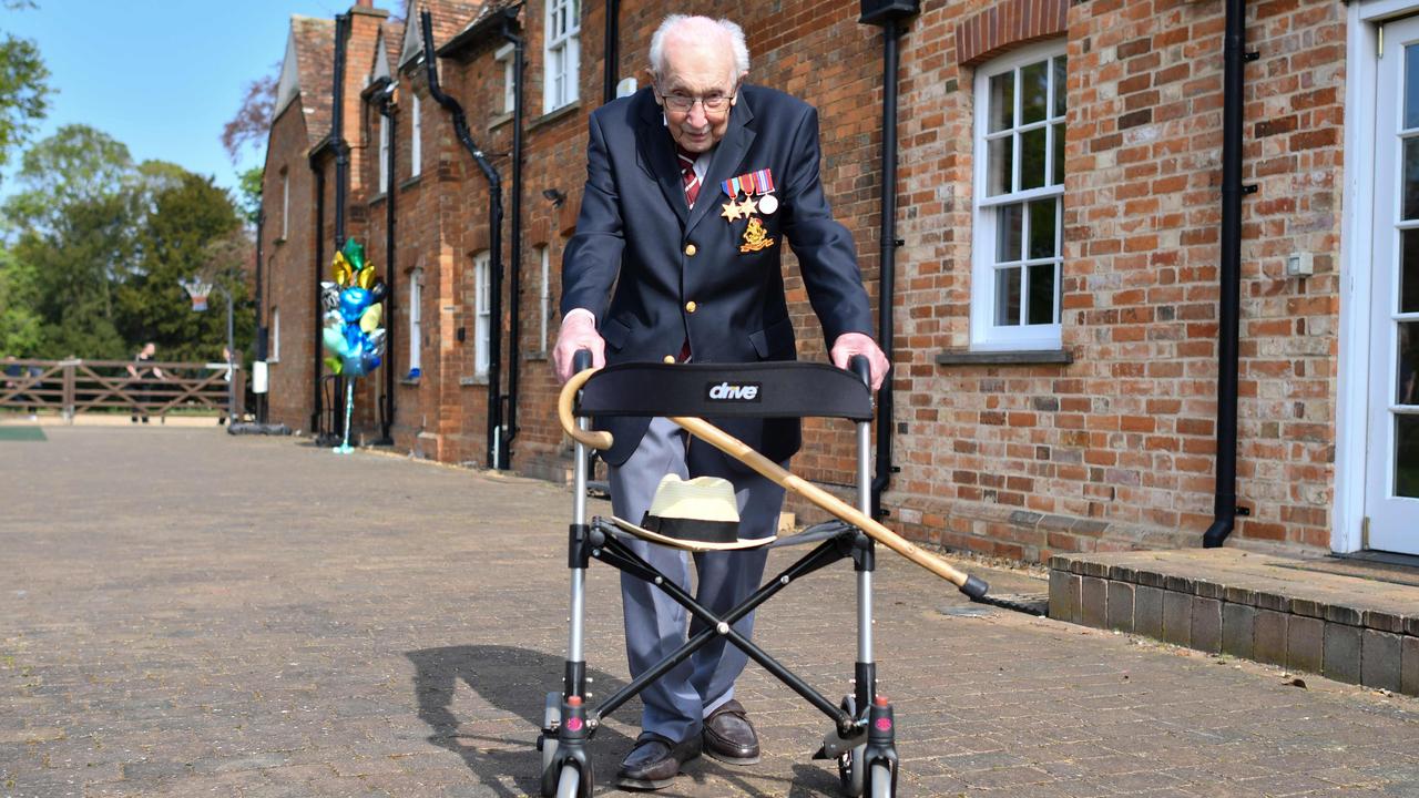 Captain Tom Moore poses with his walking frame doing a lap of his garden on April 16, 2020. Picture: AFP