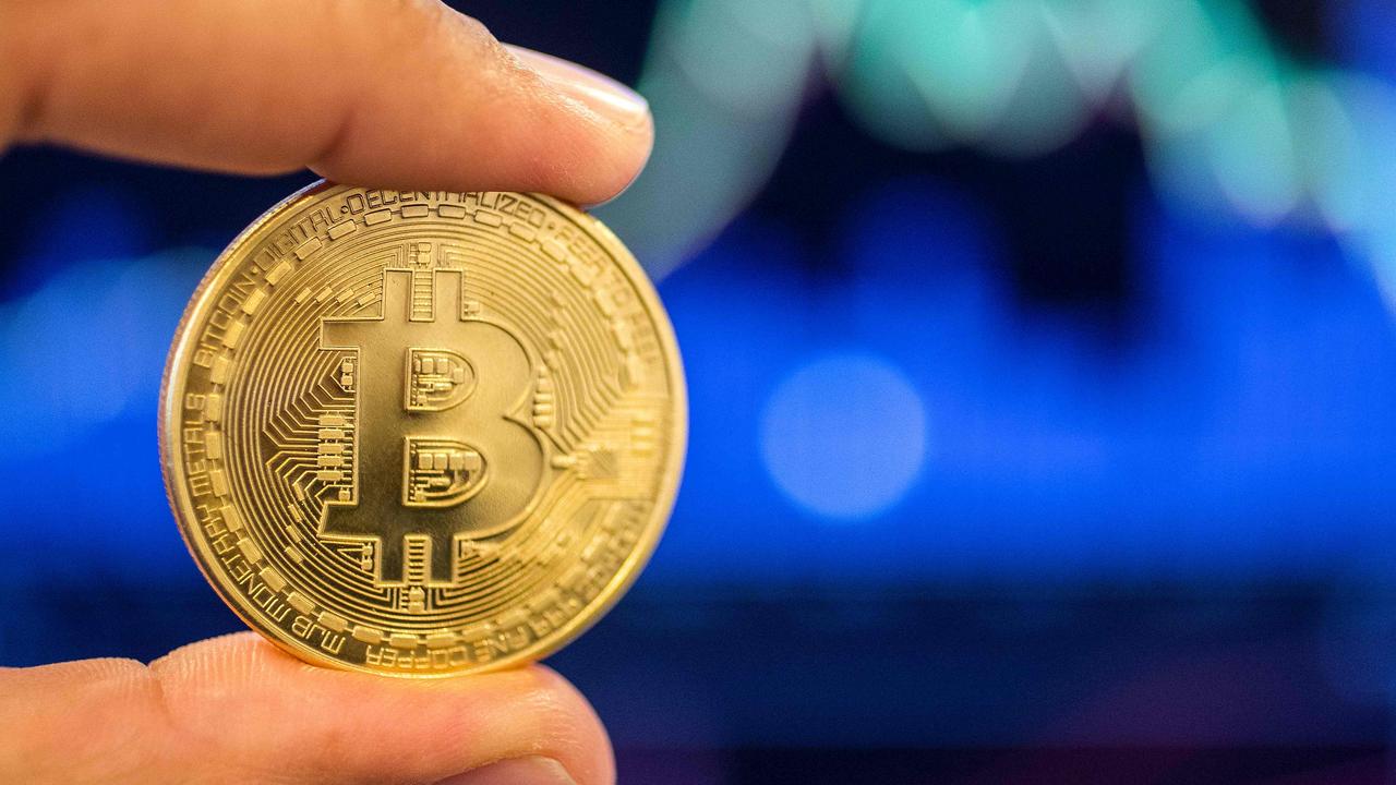 Bitcoin is breaking records again as investors bet on it becoming a mainstream form of payment. Picture: Jack Guez / AFP