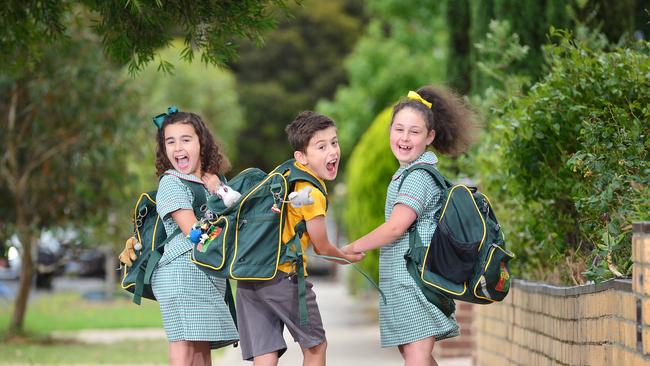 Esta Calafati, 7, Matteo Calafati, 8 and Leah Tempone, 7, are excited for their first day back at St Oliver’s Plunkett Primary School. Picture: Nicki Connolly