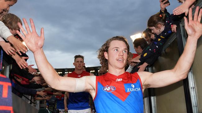 Jayden Hunt celebrates with Melbourne fans after kicking the winning goal against Carlton on Sunday. Picture: Michael Dodge (Getty).