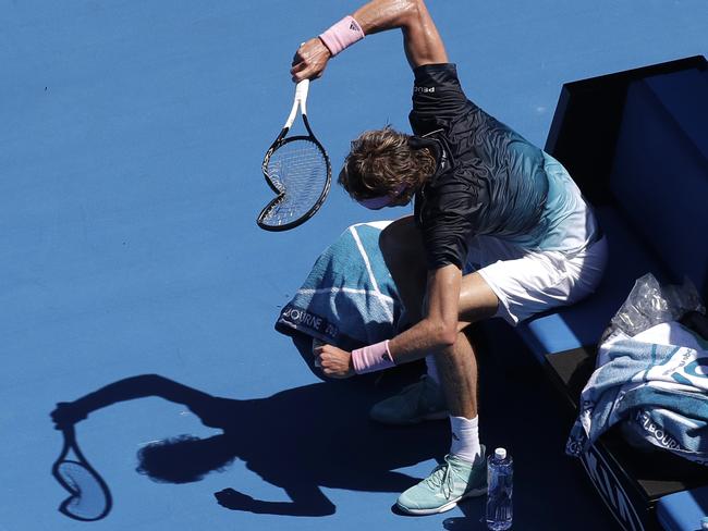 Germany's Alexander Zverev smashes his racquet in frustration.