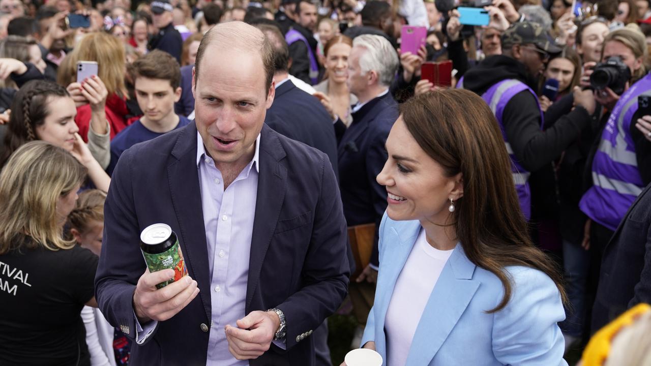 Prince William holds a can of ‘Return of the King’ Coronation Ale as he stands next to the Princess of Wales as they speak to people on the Long Walk near Windsor Castle, where the coronation concert will be held. Picture: Getty Images